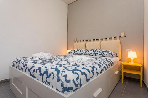 a bedroom with a bed with two dogs on it at Casa Annunziata - Bronte in Bronte