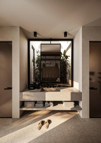 a bathroom with a sink and a large mirror at Neem - Raw Luxury Boutique Hotel Madiha - adults only in Kamburugamuwa