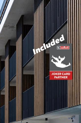 a building with a sign on the side of it at LH Suites Aparthotel - NEW since 2025 in Saalbach Hinterglemm
