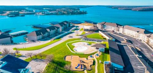 an aerial view of a resort with a body of water at Lakefront Lands End Luxury 3bed2bathpools in Osage Beach
