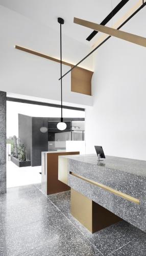 an office with a reception desk with a laptop on it at the house of mo in Shanghai