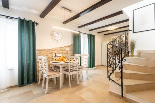a dining room with a table and chairs at Villa Palanga in Trogir