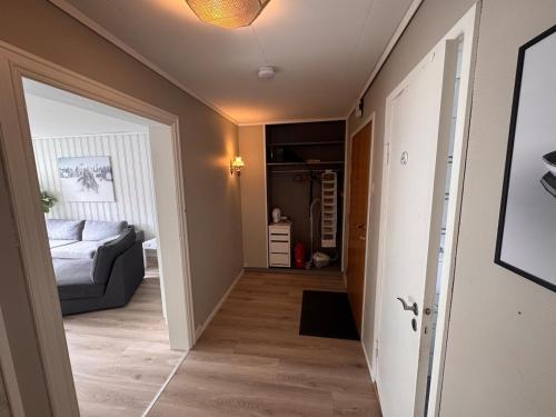 a hallway leading to a bedroom with a bed at Apart, 4 pers, Central in Odda in Odda