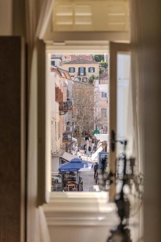 a view of a city from a window at 3 Sixty Hotel & Suites in Nafplio