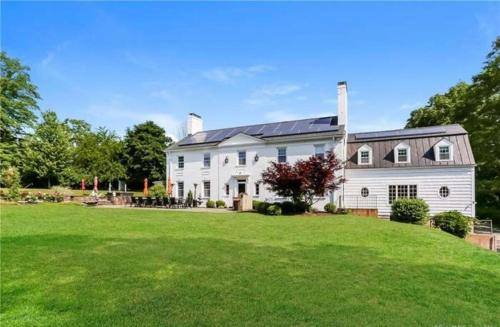 a large white house with a large yard at Luxury Estate Elegant Private The White Lion Manor in Middletown