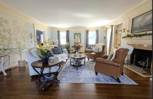 a living room with white furniture and a fireplace at Luxury Estate Elegant Private The White Lion Manor in Middletown