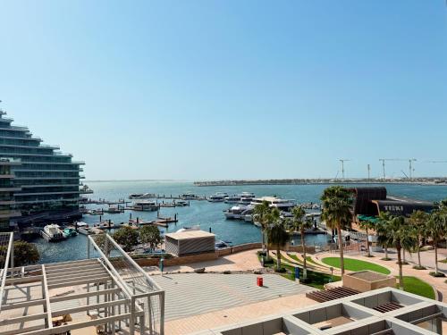 a view of a marina with boats in the water at Studio In Al Bandar Hosted By Voyage in Abu Dhabi