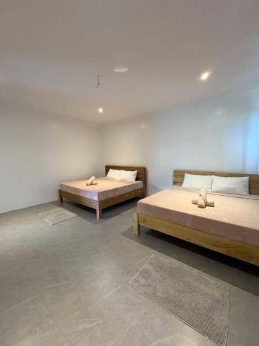A bed or beds in a room at The Nest