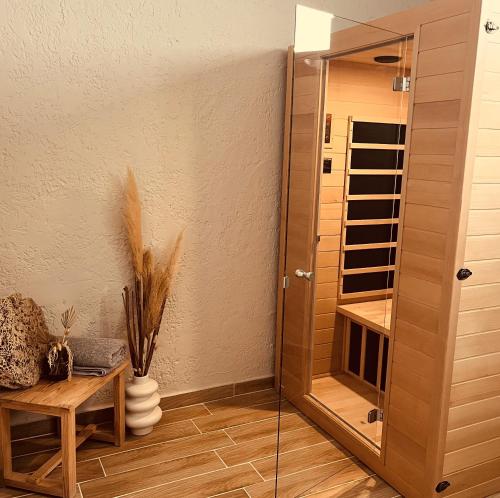a room with a mirror and a wooden table at SPONGIA HOTEL SUITES & Spa in Myrties