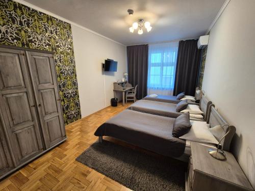 Katil atau katil-katil dalam bilik di Hotel Mikołaj