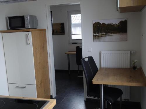 Η κουζίνα ή μικρή κουζίνα στο Birkenhain 3a - Lastering Ferienhäuser & Apartments