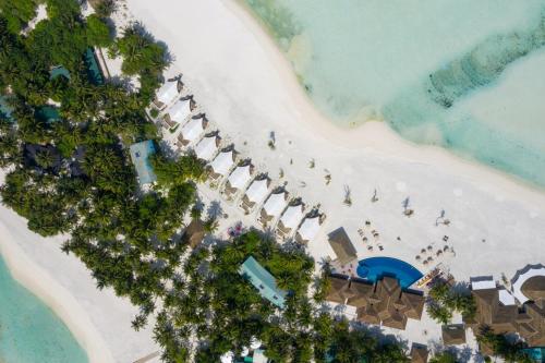 an overhead view of a beach with a resort at Cinnamon Hakuraa Huraa Maldives - All Inclusive in Meemu Atoll