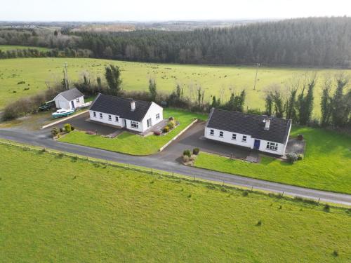 an aerial view of two white houses in a field at Cassidy Cottages 3 Bed in Cavan