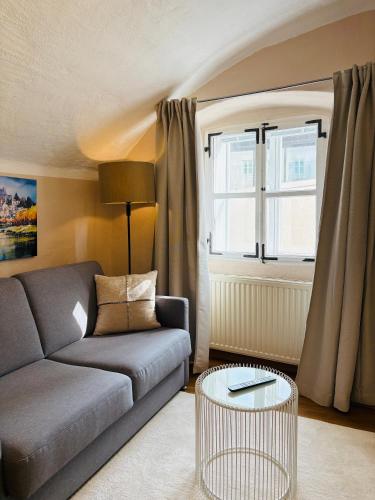 a living room with a couch and a table at APT. STONE-LODGE in Salzburg