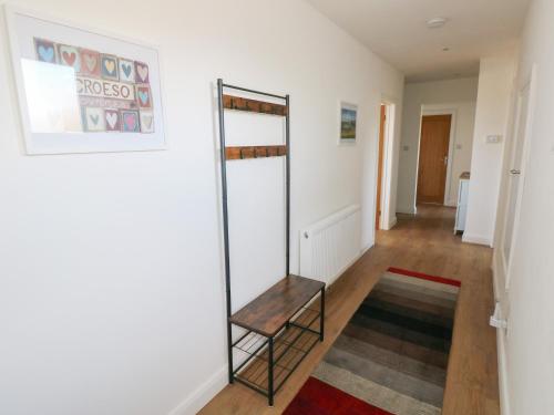a room with a ladder and a shelf on the wall at Arfryn in Haverfordwest