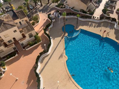 an overhead view of a swimming pool at a resort at Newly renovated apartment in La Manga del Mar Menor