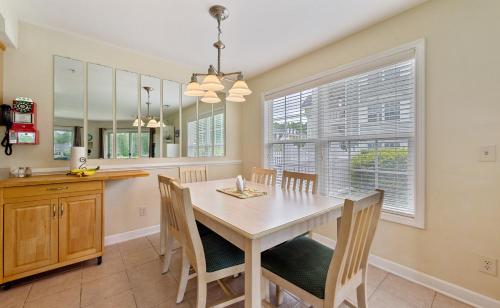 a kitchen and dining room with a table and chairs at Relax, Beach, Golf, Shop, Repeat resort in Calabash
