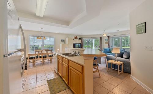 a kitchen and living room with a couch and a table at Relax, Beach, Golf, Shop, Repeat resort in Calabash