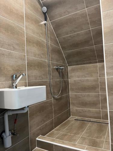 a bathroom with a shower and a sink at Charming apartment central in Lucerne in Lucerne