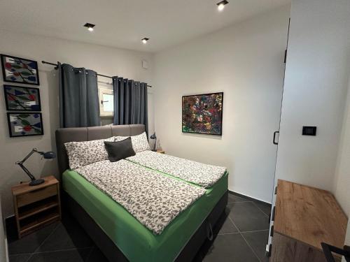 a bedroom with a bed in a room at Apartments Urban in Poreč