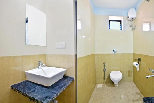 a bathroom with a sink and a toilet at Hotel O Sai Leela in Goa