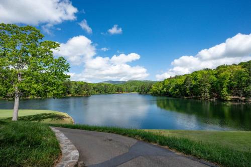 a view of a lake with trees and a road at Southern Views in Jasper