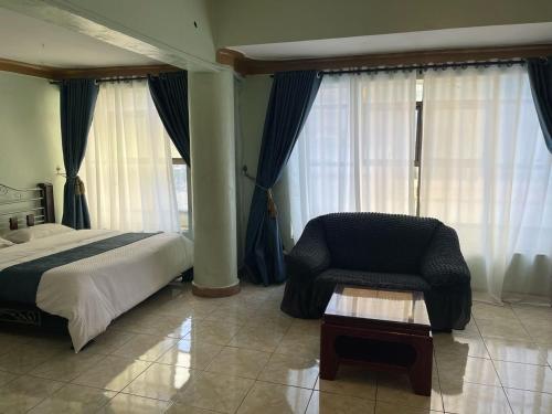 EXCELLENT HOTEL KAMPAlAにあるベッド