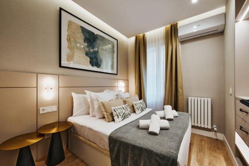 a hotel room with a bed and a window at Fuencarral Living 7BR 7BH in Madrid