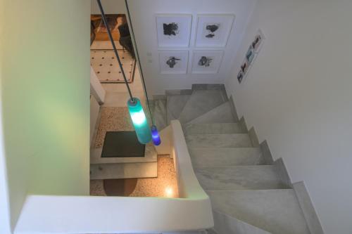 an overhead view of a staircase with a blue light at Blue Home, Luxury Villa with Pool in the City Centre in Larisa