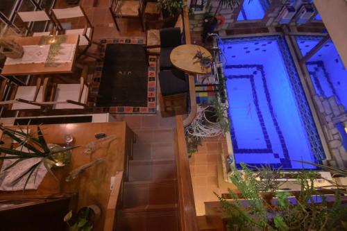 an overhead view of a room with a blue light at Blue Home, Luxury Villa with Pool in the City Centre in Larisa
