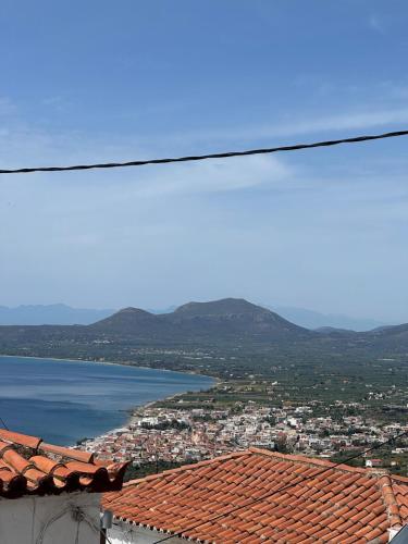 a view of a city and a body of water at Patricia's Traditional Guesthouse in Lákhion