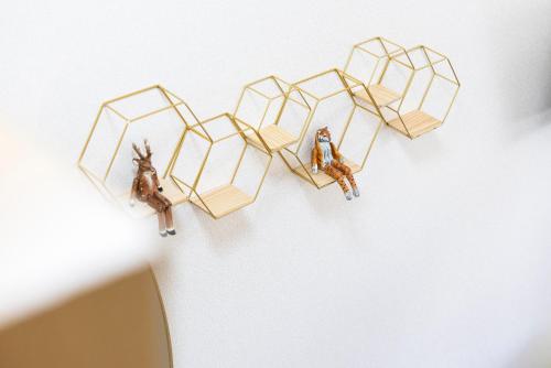 a pair of honey bees hanging on a wall at Otani gofuku in Fukuoka