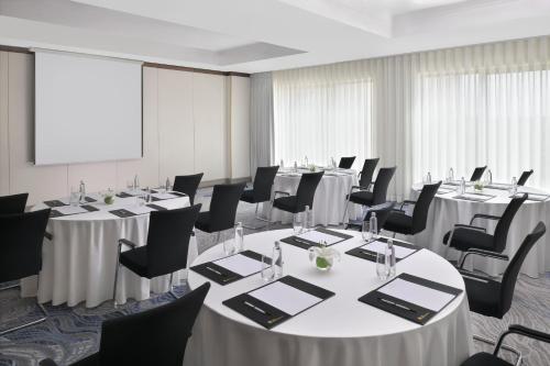 a conference room with long tables and chairs at Al Ahsa InterContinental by IHG in Al Ahsa