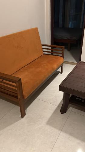 a wooden bench sitting on top of a floor at G 5 Gayathri Enclave 2 Bedroom Fully Furnished Apt in Trivandrum