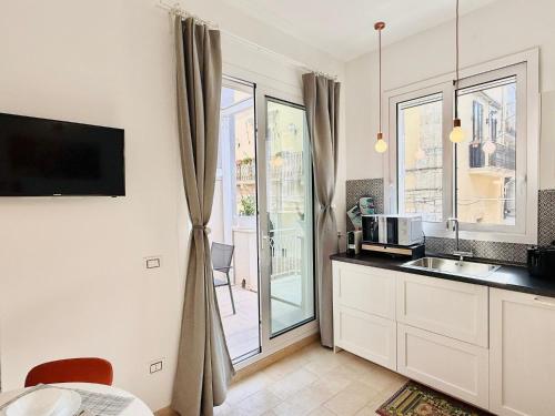 a kitchen with a sink and a counter top at La casa di Tina in Pachino