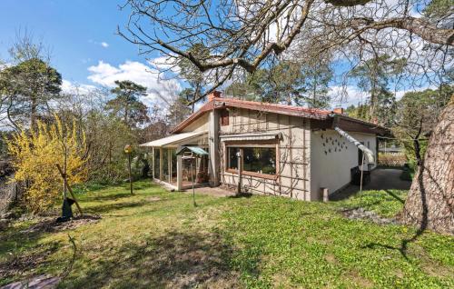 a small house in the middle of a yard at Nice Home In Rangsdorf With Wifi in Rangsdorf