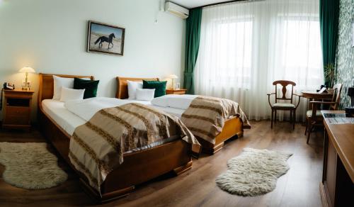 Postel nebo postele na pokoji v ubytování Septimia Hotels & Spa Resort