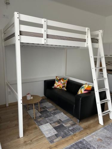 Una cama o camas en una habitación de Pullman Apartman