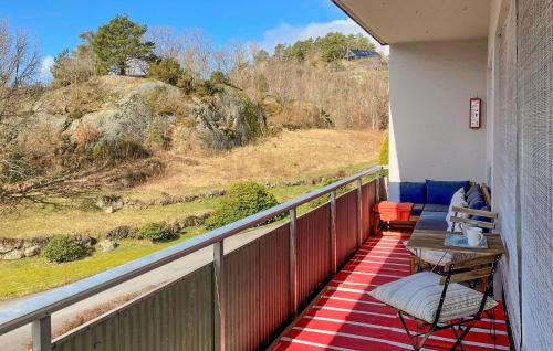 a balcony with a view of a hill at 3 Bedroom Awesome Apartment In Mandal in Mandal