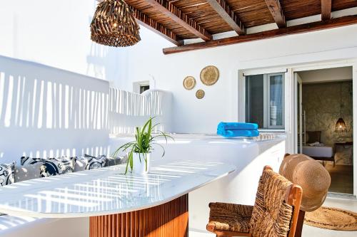 a dining room with a glass table and chairs at Dream on Plaka in Plaka