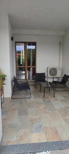 a living room with chairs and a radiator on a floor at Nautica Tarello - Casa Ena BeB in Viverone