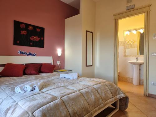 Ένα ή περισσότερα κρεβάτια σε δωμάτιο στο Villa Baia Smeralda by Holiday World