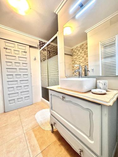 a bathroom with a sink and a mirror at Casa Milana in Moraira
