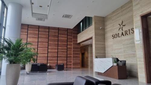 a lobby with a santas sign on the wall at 1 bed Apartment in Osu - Accra, Ghana - Solaris Apartments in Accra