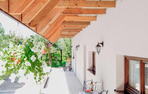 a room with white walls and a wooden ceiling at Pet Friendly Home In Sulów in Sułów