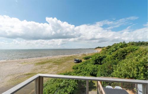 a view of the beach from the balcony of a house at 2 Bedroom Stunning Home In Øster Assels in Øster Assels
