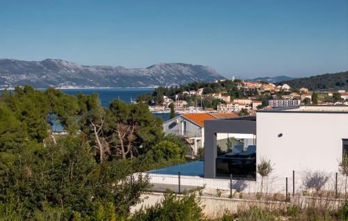a house with a view of the water at Beautiful Home In Lumbarda in Lumbarda