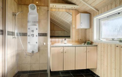 a bathroom with a shower and a sink at Gorgeous Home In Vinderup With Sauna in Vinderup