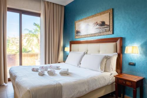 Postel nebo postele na pokoji v ubytování Hotel Flora