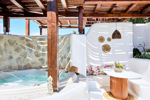 a wellness center with a hot tub and a table at Dream on Plaka in Plaka